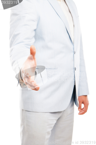 Image of Close up of businessman hand extended to handshake isolated on white 