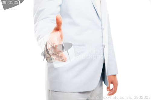 Image of Close up of businessman hand extended to handshake isolated on white 