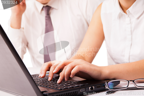 Image of Businessman and businesswoman working on laptop isolated