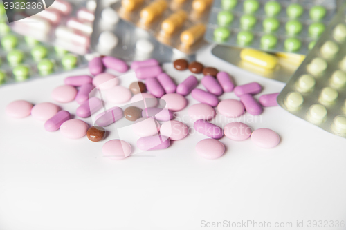 Image of Colorful tablets on white background