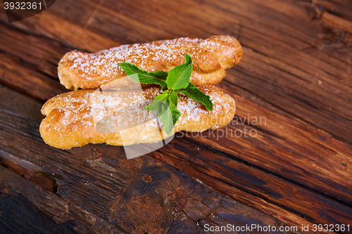 Image of Two eclair decorated with mint