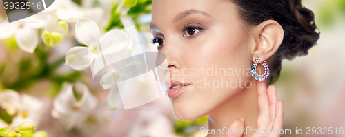 Image of close up of beautiful woman face with earring