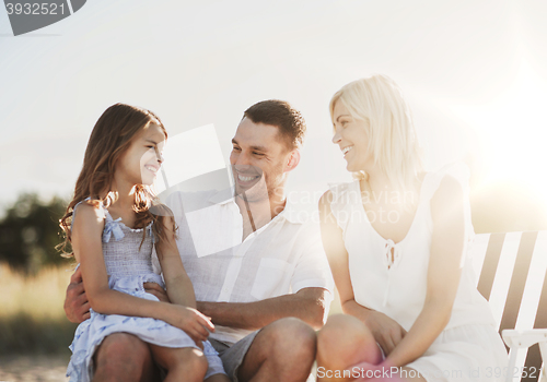 Image of happy family having a picnic