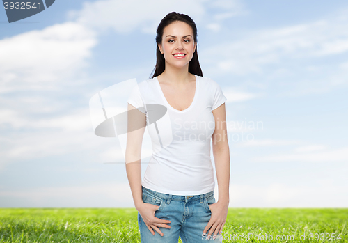 Image of happy young woman or teenage girl in white t-shirt