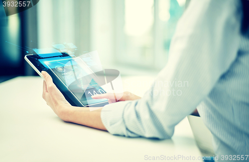 Image of close up of woman hands with tablet pc at office