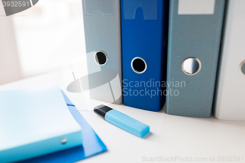 Image of close up of ring binders and files on office table