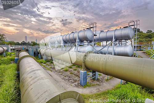 Image of Oil and gas industry refinery factory at sunset