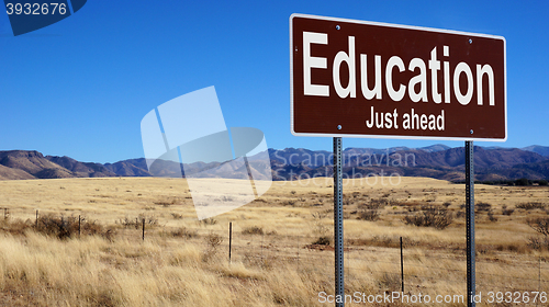 Image of Education brown road sign