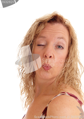 Image of Woman blowing a kiss.