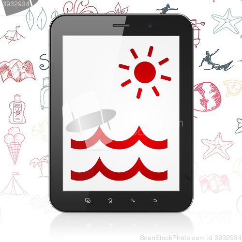 Image of Vacation concept: Tablet Computer with Beach on display