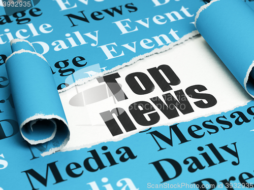 Image of News concept: black text Top News under the piece of  torn paper
