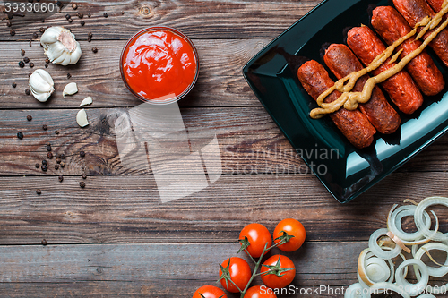 Image of Sausage roasted on the grill.