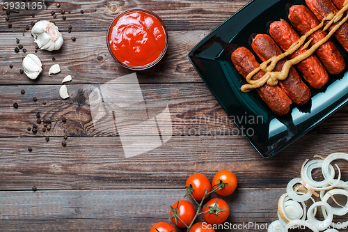 Image of Sausage roasted on the grill.