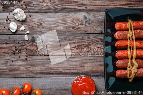 Image of Sausage roasted on the grill.