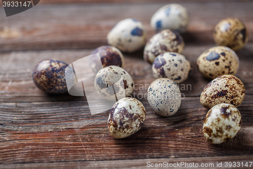 Image of Group of quail eggs on thewooden background