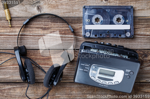 Image of Music concept. Top view of cassette tape, audio player and headphones.