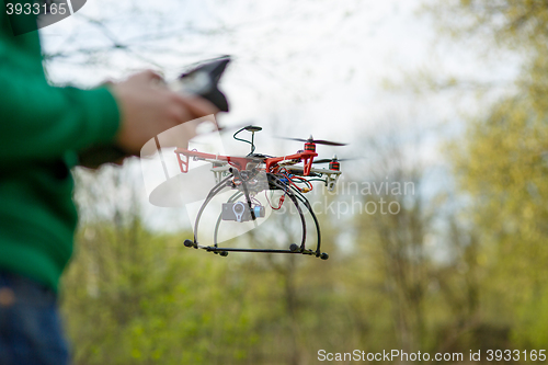 Image of Man controling a drone.