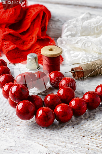 Image of Fabric and large coral beads