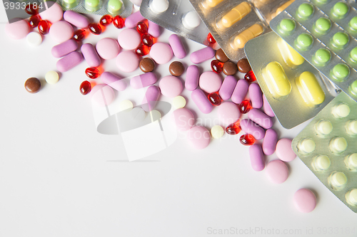 Image of Colorful tablets on white background