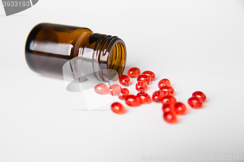 Image of Pills scattered on white background