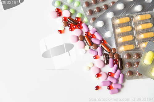 Image of Colorful tablets on white background