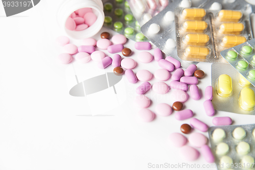 Image of Colorful tablets on white background