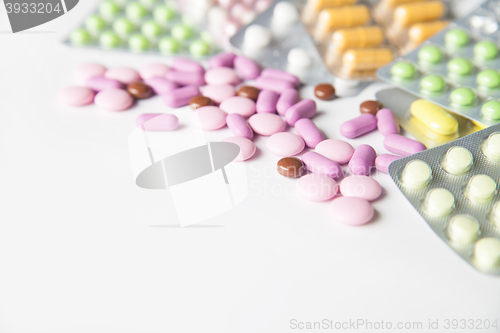 Image of Colorful tablets on white background