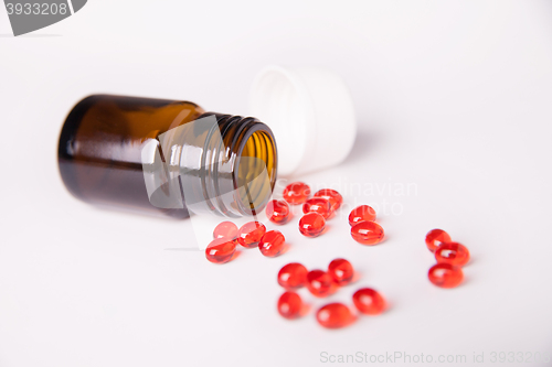 Image of Pills scattered on white background