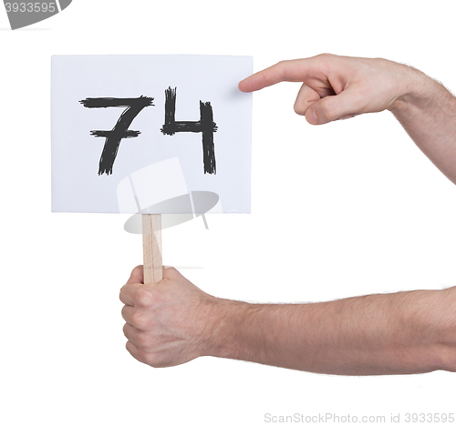 Image of Sign with a number, 74