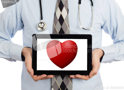 Image of Doctor holding tablet - Red heart