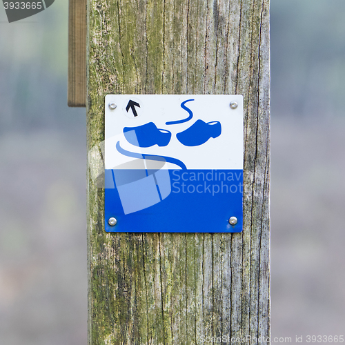 Image of Sign close up, wooden shoes