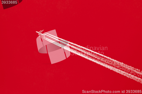 Image of Plane in blue sky - Bright red sky