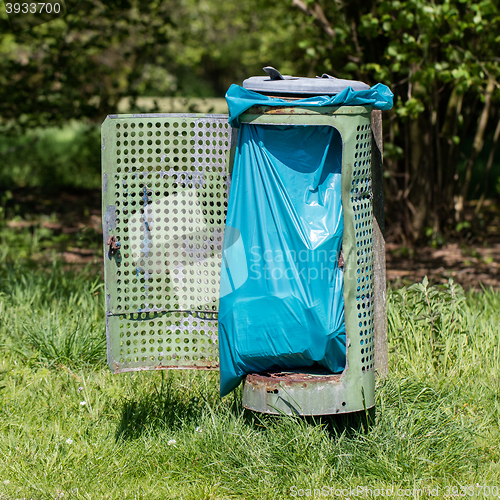 Image of Broken litter bin in the park