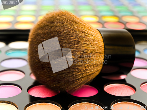 Image of Multicolored Eye Shadows and Cosmetic Brush