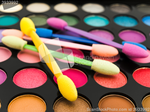 Image of Multicolored Eye Shadows and Cosmetic Brush