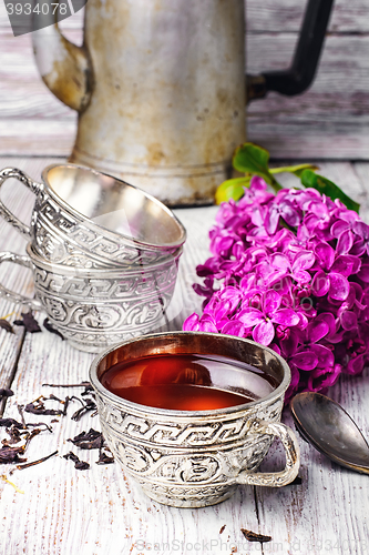 Image of Stylish metal cup of tea