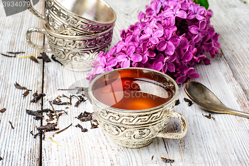 Image of Stylish metal cup of tea