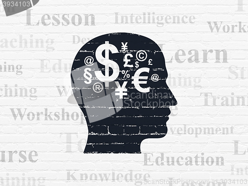 Image of Learning concept: Head With Finance Symbol on wall background