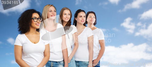 Image of group of happy different women in white t-shirts