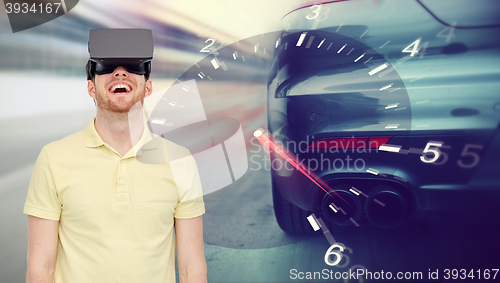 Image of man in virtual reality headset and car racing game