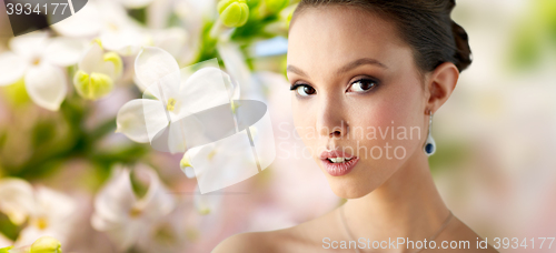 Image of close up of beautiful woman face with earring