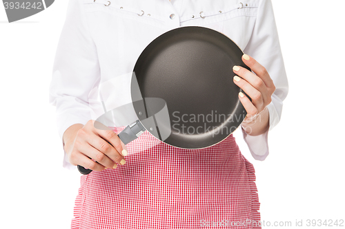 Image of Woman holding frying pan