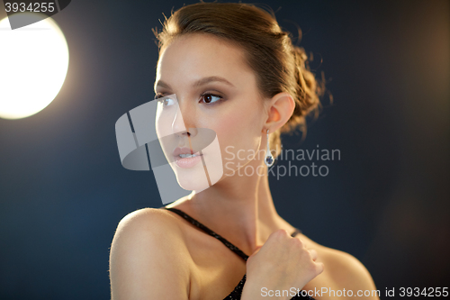 Image of beautiful young asian woman with earring