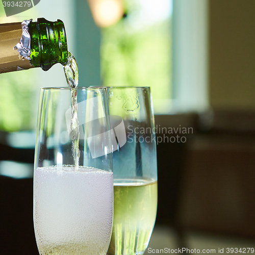 Image of Champagne pouring in two glasses