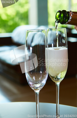 Image of Champagne pouring in two glasses