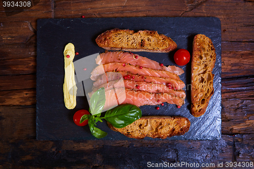 Image of salmon slices and tomatoes