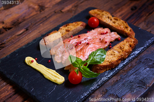 Image of salmon slices and tomatoes