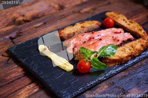 Image of salmon slices and tomatoes