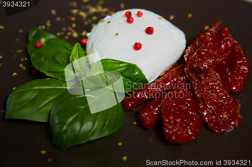 Image of Buffalo mozzarella Burrata, basil and tomatoes