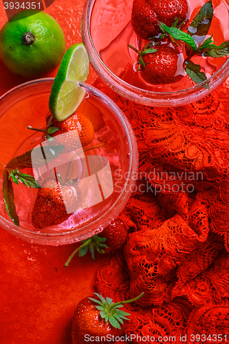 Image of wine with strawberries and lime